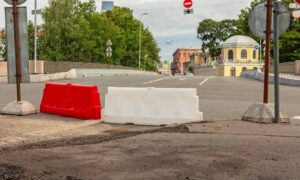 Street repair road barriers - ALTA SURVEY Mississippi Temporary road barriers set up for street repair work, showing where a boundary survey may help define public and private areas