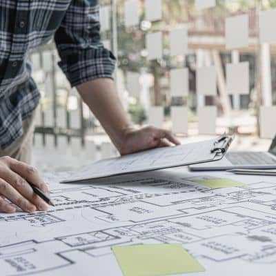Reviewing boundary lines and site details during a due diligence survey for property evaluation