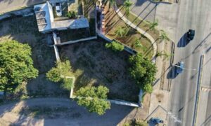 Aerial view of a commercial property and surrounding roads, highlighting the site features surveying companies assess before rezoning