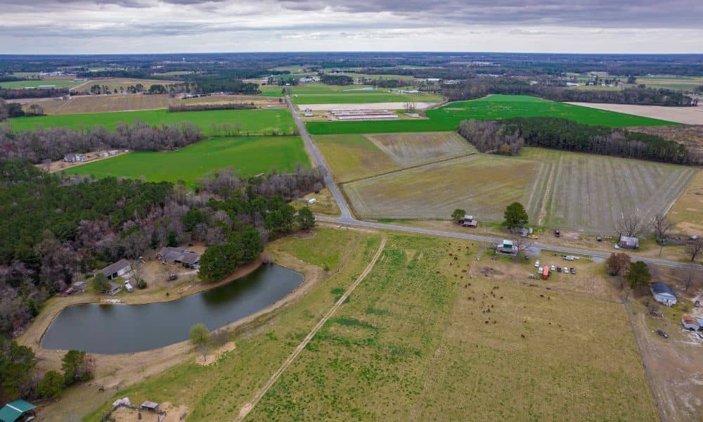 Aerial view of a rural land tract where a cadastral surveyor may define the remaining parcel after a partial sale